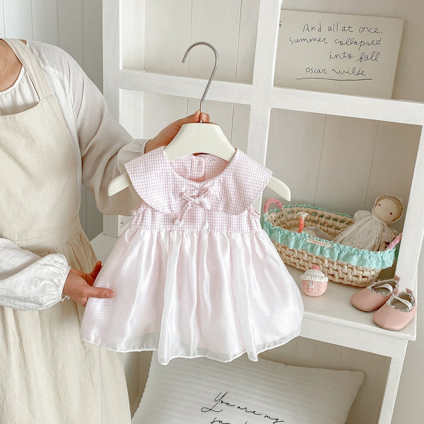 checkered bow pom pom dress